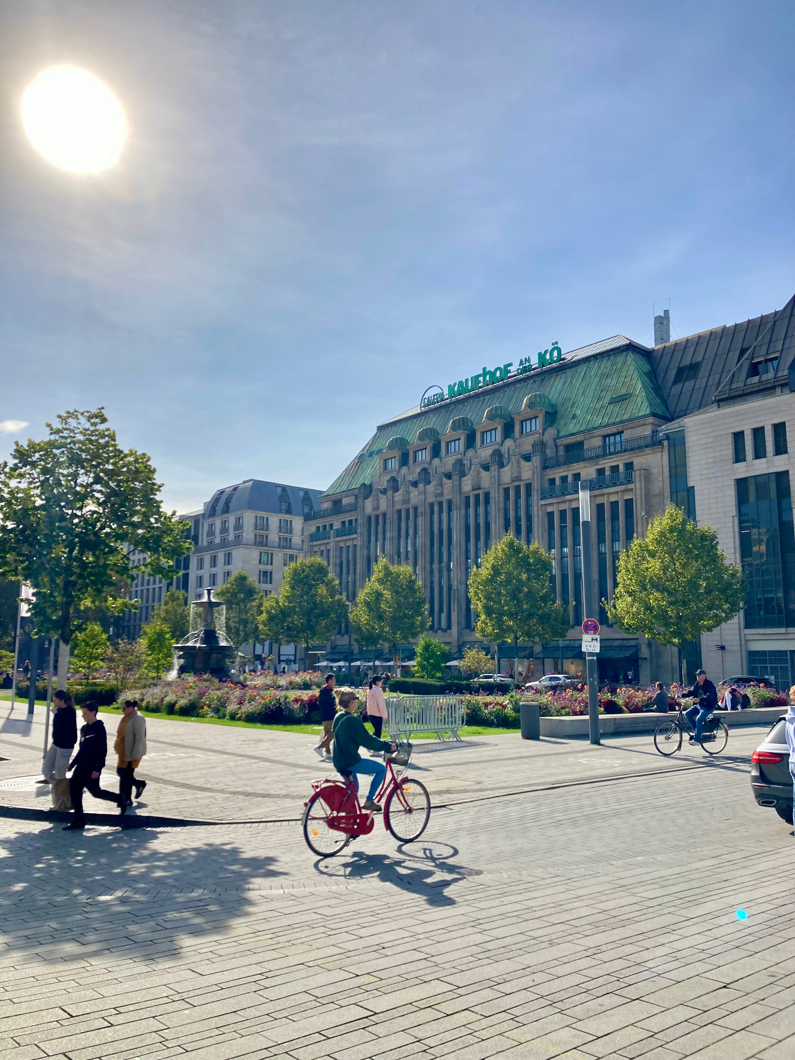 Where towers rise from green parks and rivers flow through cities